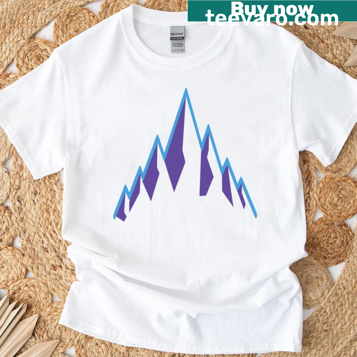 T-shirt featuring a playful mountain landscape illustration — on a men's t-shirt