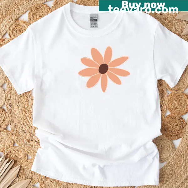 Minimalist wildflower doodle on a sunset blush T-shirt
