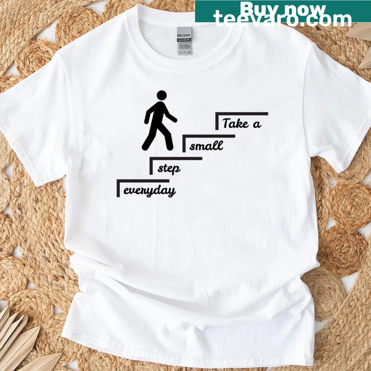 Motivational quote T-shirt encouraging daily progress with inspiring text — on a men's t-shirt