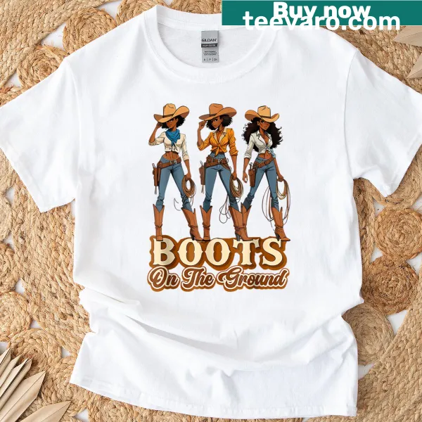 Vintage-style graphic T-shirt featuring cowboy boots and playful text