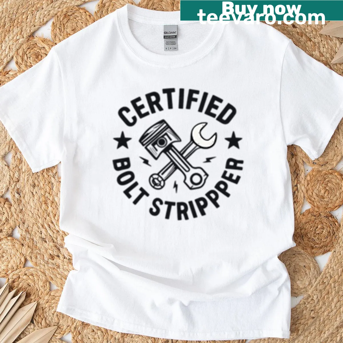 Graphic t-shirt with wrench and skull crossbones illustration — on a men's t-shirt