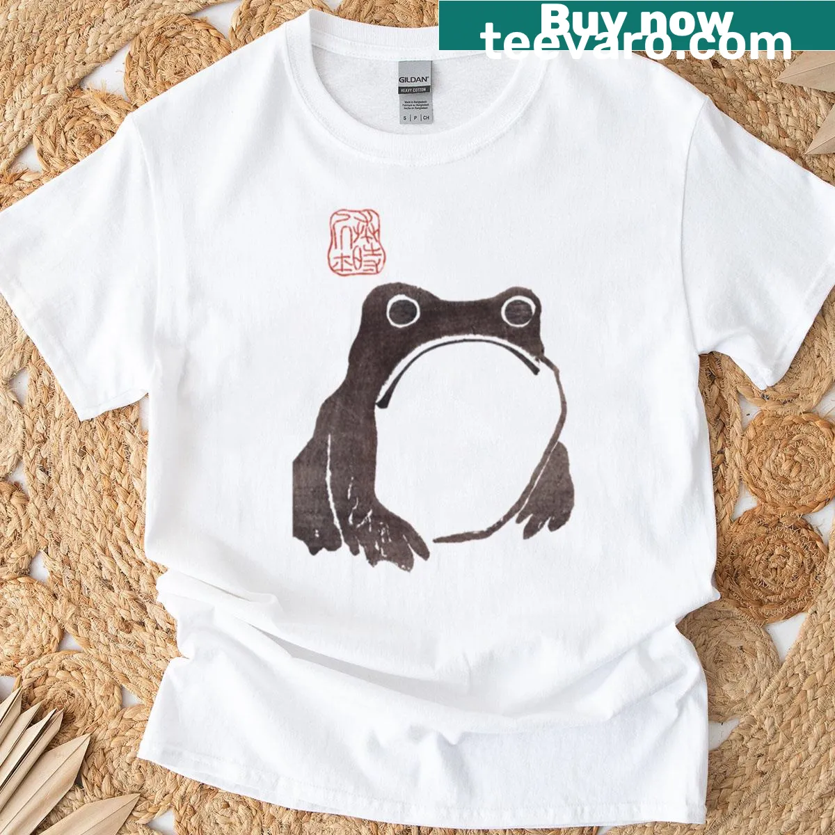 Humorous T-shirt featuring a cartoon of a grumpy frog illustration. — on a men's t-shirt