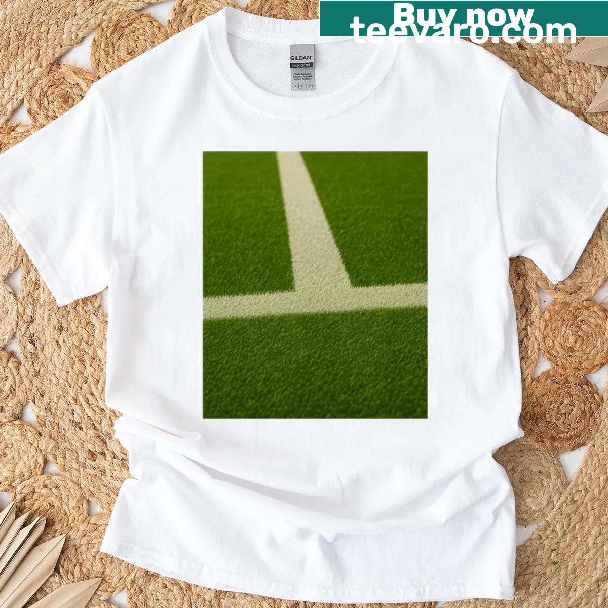 Vintage distressed T-shirt featuring a cross design with grass background — on a men's t-shirt