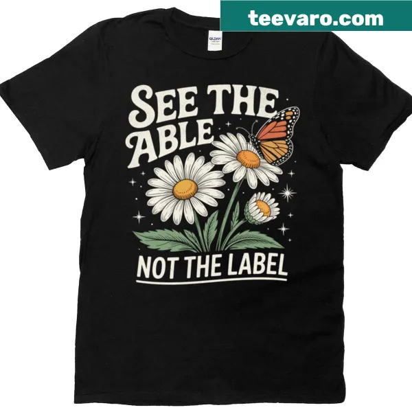Floral t-shirt with the message 'See The Able Not The Label.'