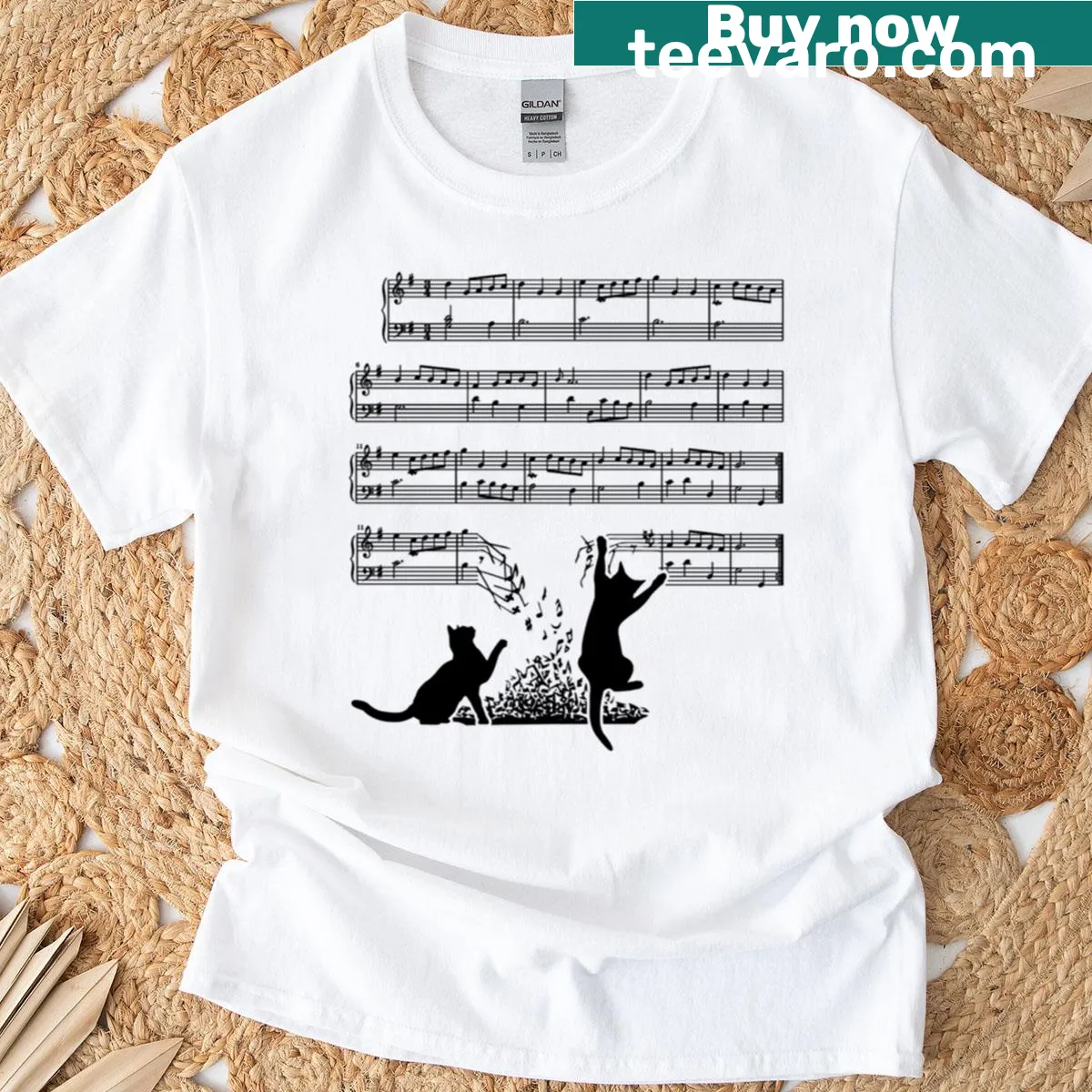 Whimsical cats playing with musical notes on a music sheet — on a men's t-shirt