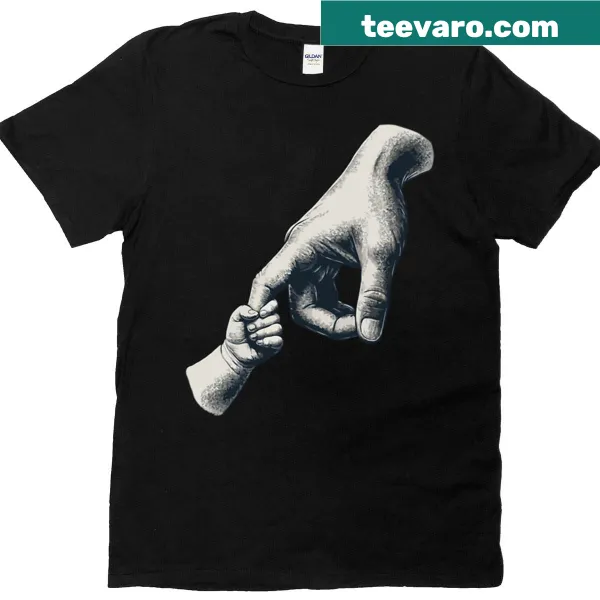 T-shirt featuring a graphic of a dad and kid's hands together.