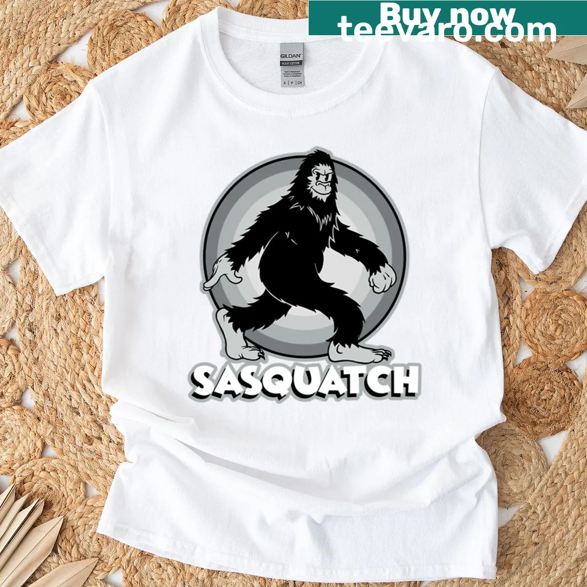 Oversized T-shirt featuring an illustration of Sasquatch with text — on a men's t-shirt