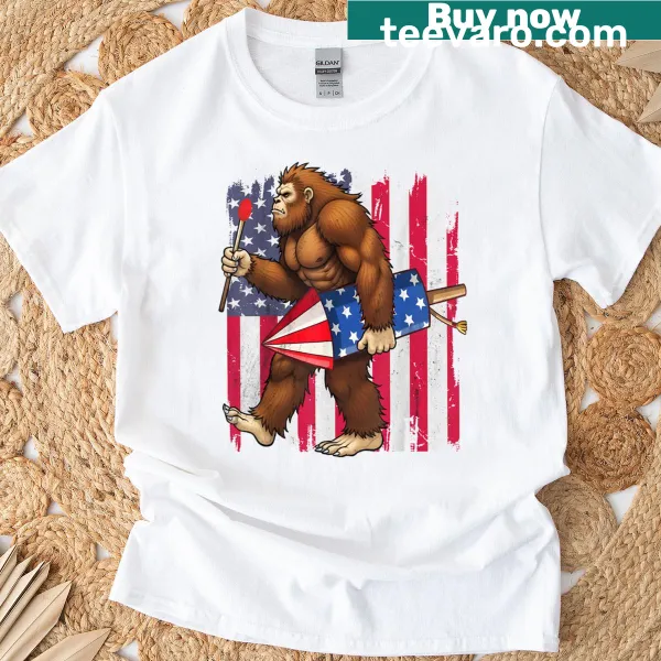 Bigfoot surrounded by fireworks and American flag on a t-shirt.