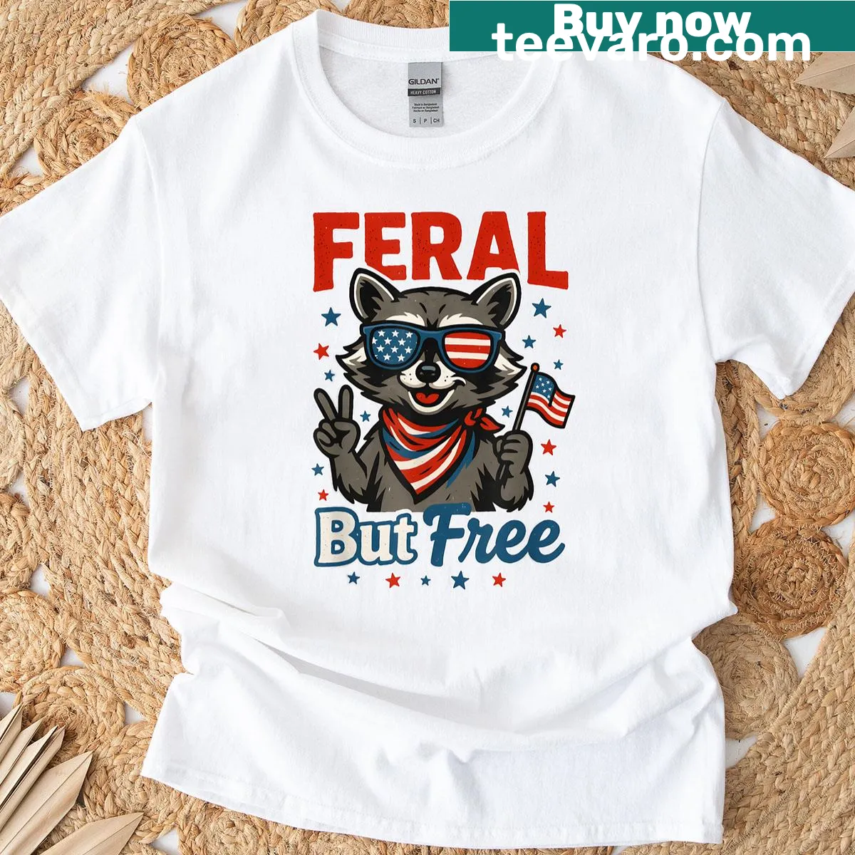 Cartoon raccoon graphic with the text 'Feral But Free' — on a men's t-shirt