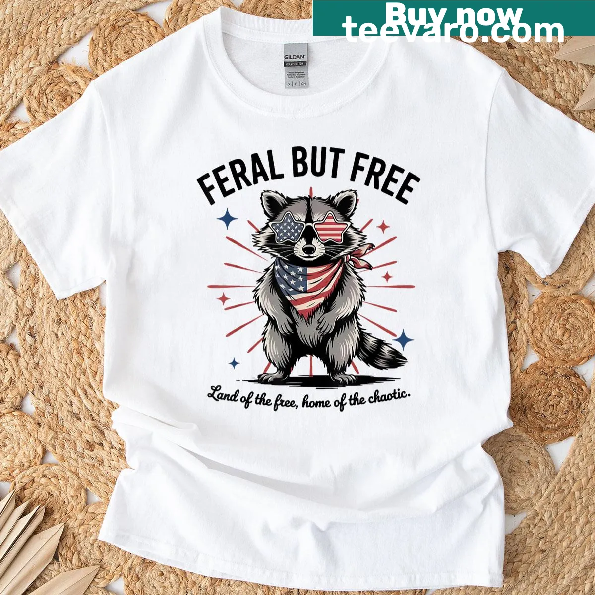 T-shirt featuring a raccoon graphic and 'Feral But Free' text — on a men's t-shirt