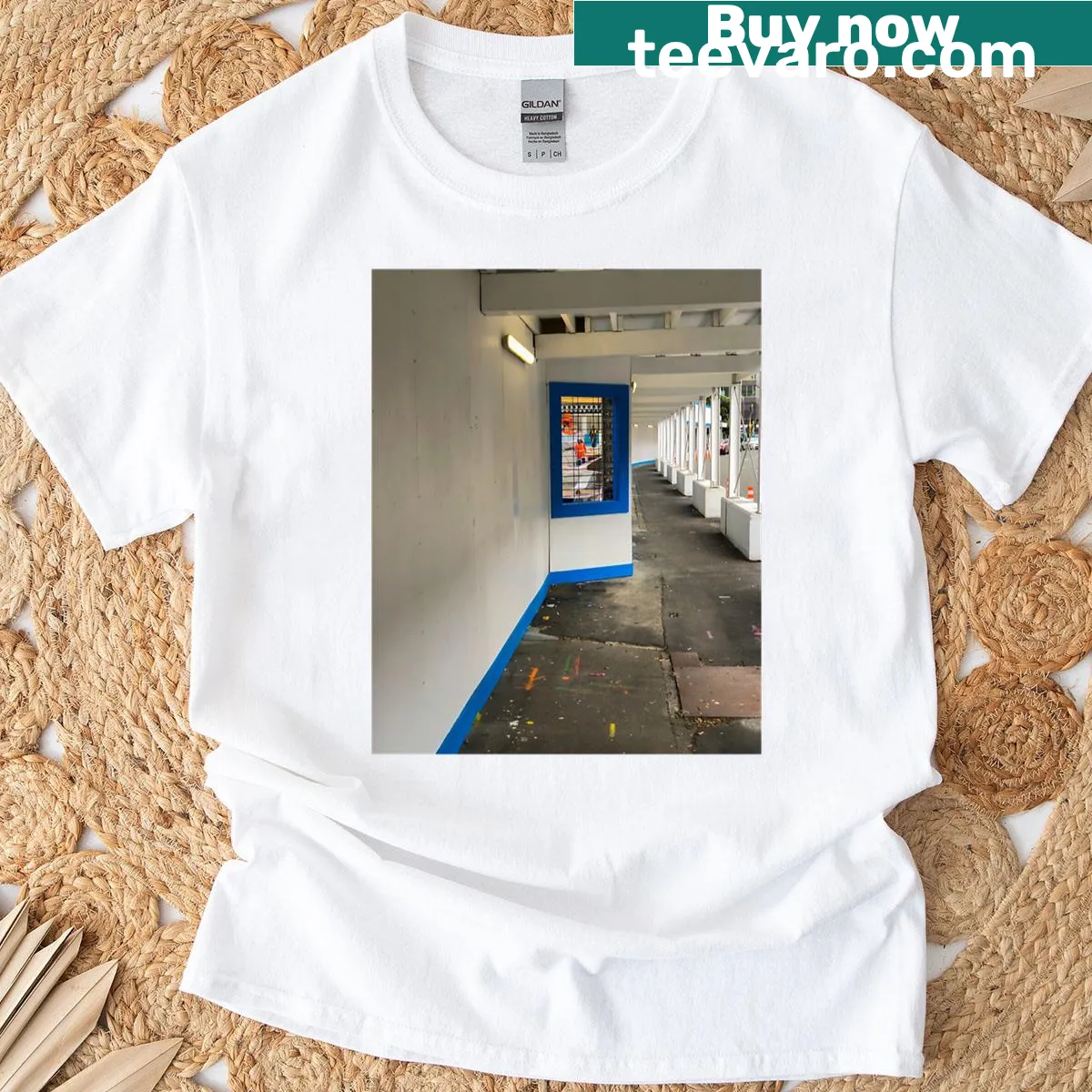 Line-art graphic of urban construction viewed through a walkway — on a men's t-shirt