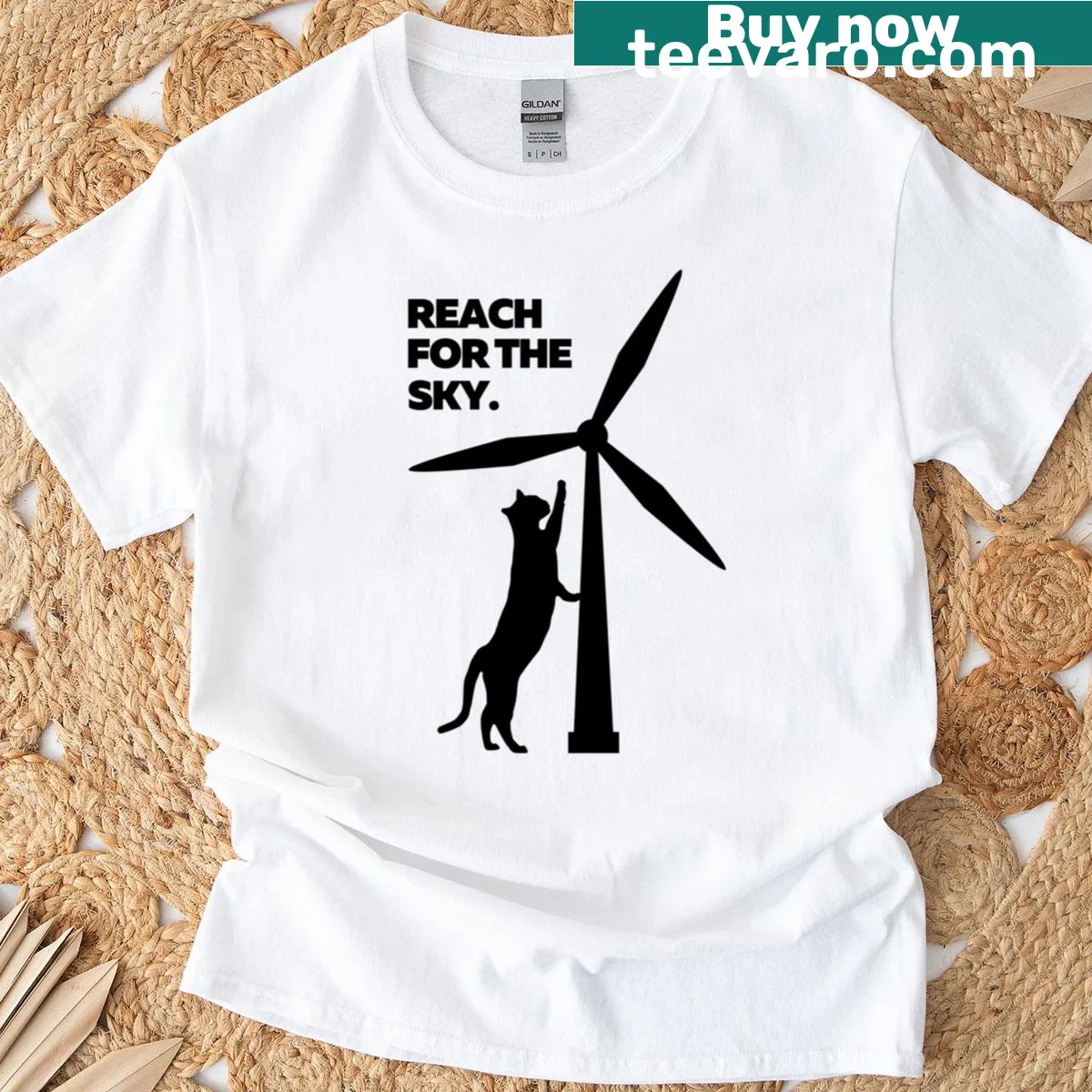 T-shirt featuring a cat reaching for the sky by a wind turbine. — on a men's t-shirt