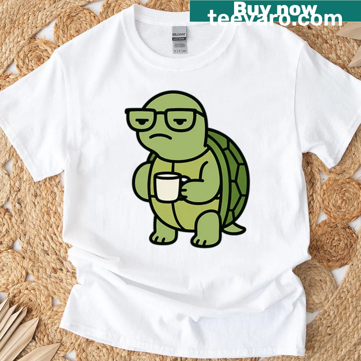 T-shirt displaying a grumpy turtle illustration with coffee — on a men's t-shirt