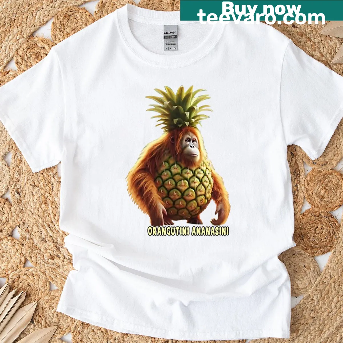 Playful cartoon character Orangutini Ananasini featured on T-shirt — on a men's t-shirt