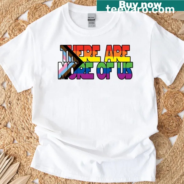 Text 'More Of Us' on a pride-themed T-shirt