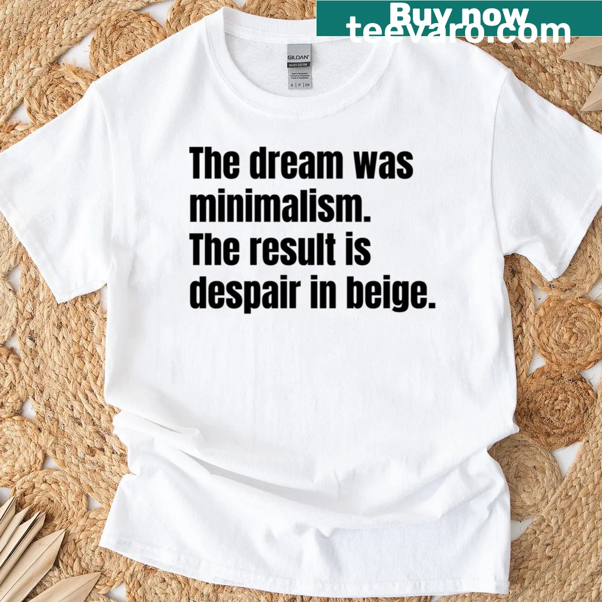 Minimalist tee with the text 'The Dream Was Minimalism The Result Is Despair In Beige' — on a men's t-shirt