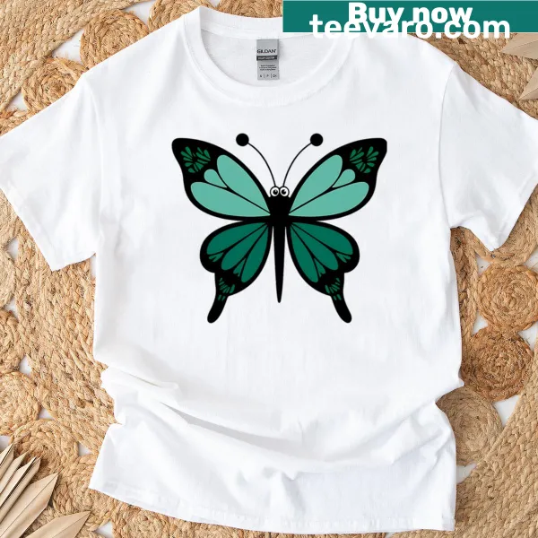 Butterfly graphic on a green T-shirt, symbolizing nature and transformation.