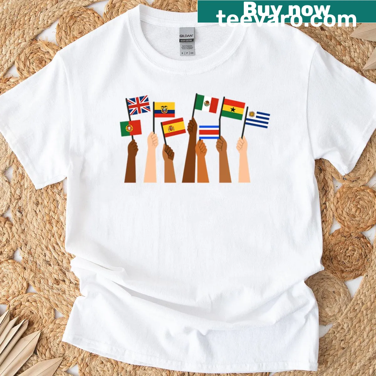T-shirt with graphic of hands holding various country flags, symbolizing unity and diversity. — on a men's t-shirt