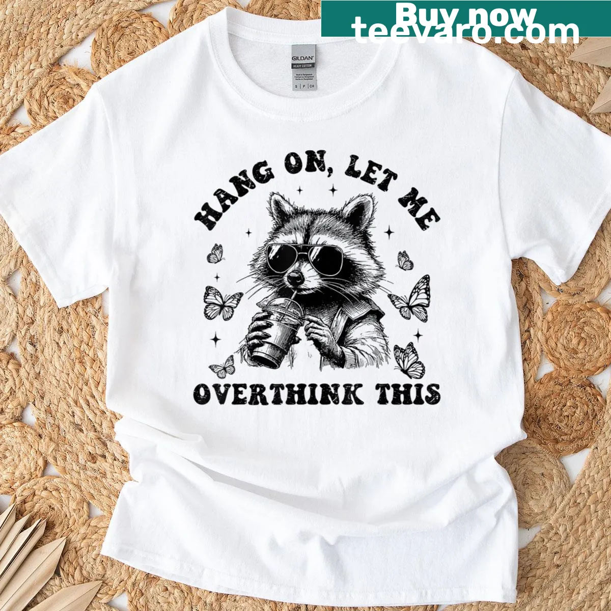 Funny t-shirt with a raccoon and butterfly overthinking design — on a men's t-shirt