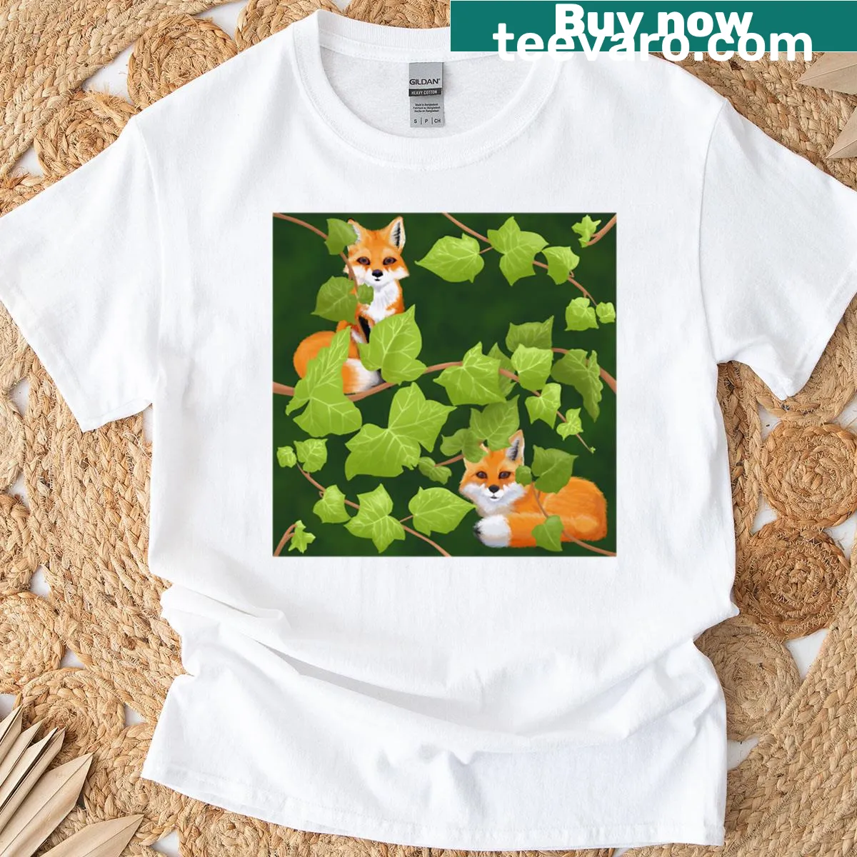 Illustrated T-shirt featuring playful foxes among ivy vines — on a men's t-shirt