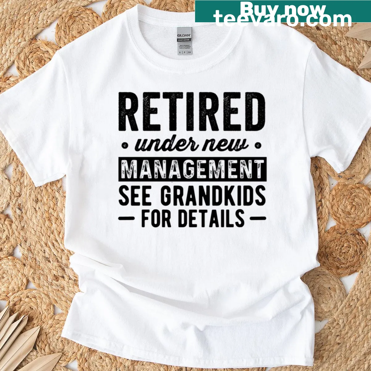 Vintage t-shirt stating 'Retired Under New Management' with a playful tone — on a men's t-shirt