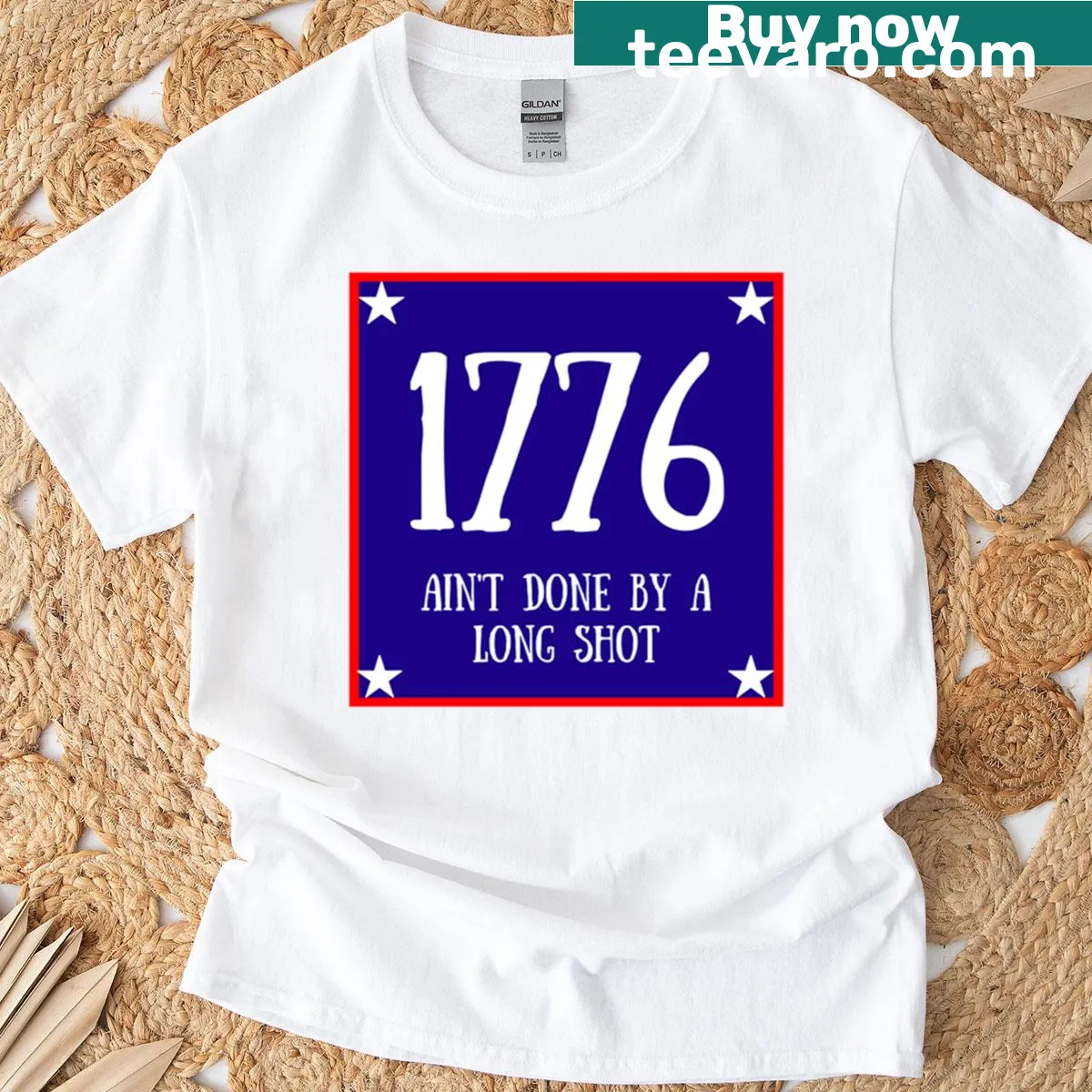 Typography t-shirt with '1776 Ain't Done by a Long Shot' text — on a men's t-shirt