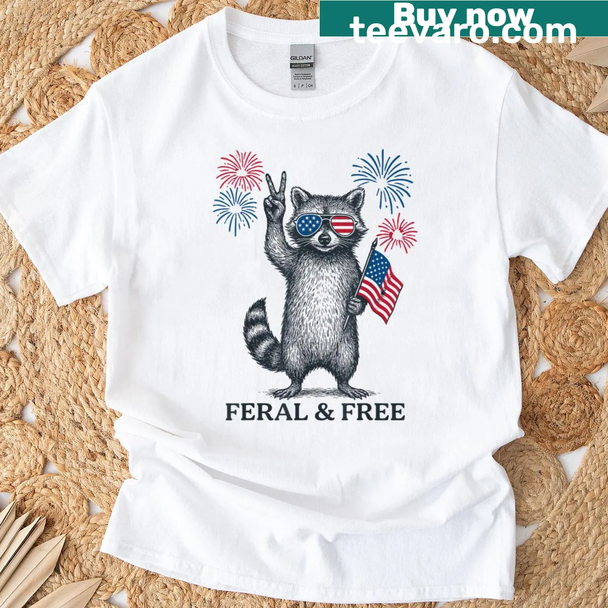 Vintage-style t-shirt featuring a funny raccoon and the phrase 'Feral But Free'. — on a men's t-shirt