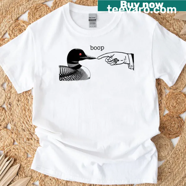 Cartoon loon and human hand on a t-shirt for loon lovers.