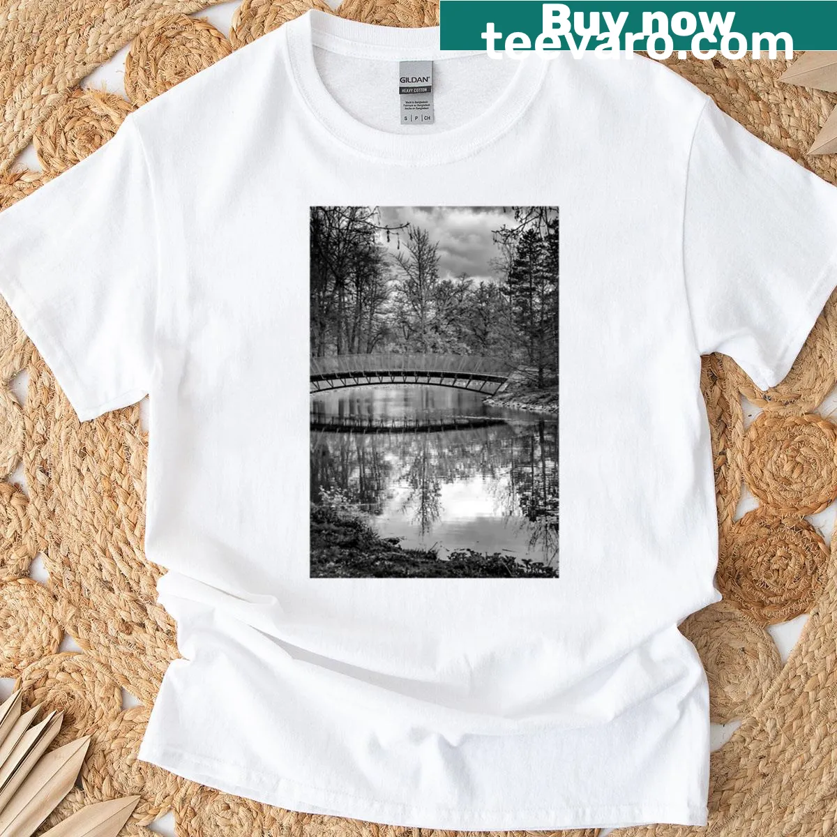 Black and white bridge reflection graphic on t-shirt — on a men's t-shirt