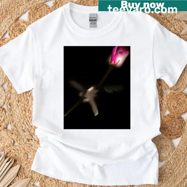 Graphic t-shirt featuring stylized bones and floral motifs