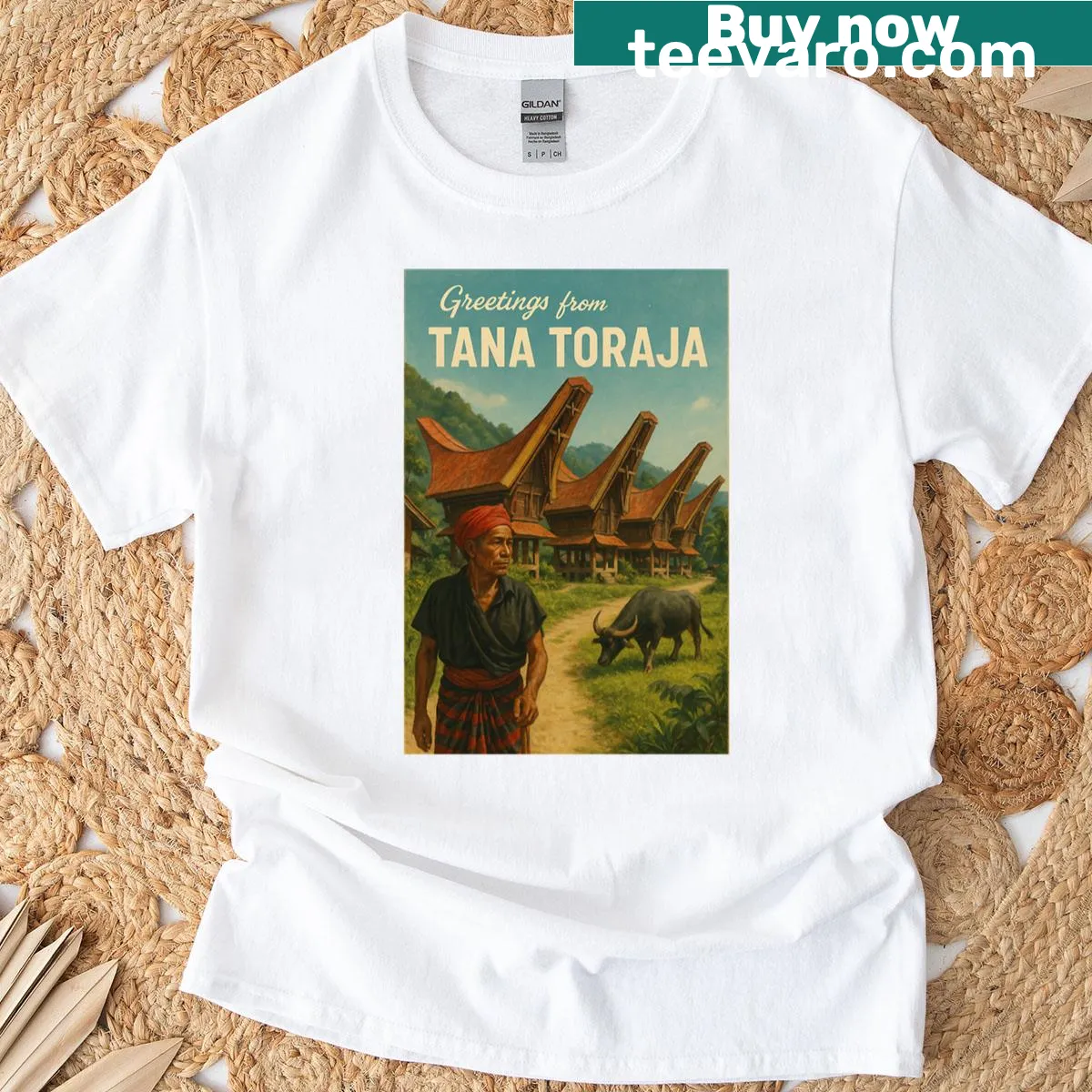 Oversized T-shirt featuring traditional Tana Toraja homes and culture. — on a men's t-shirt