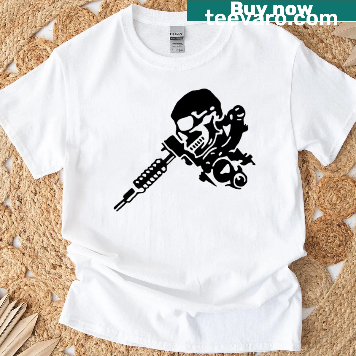 Skull and tattoo machine graphic on a t-shirt — on a men's t-shirt