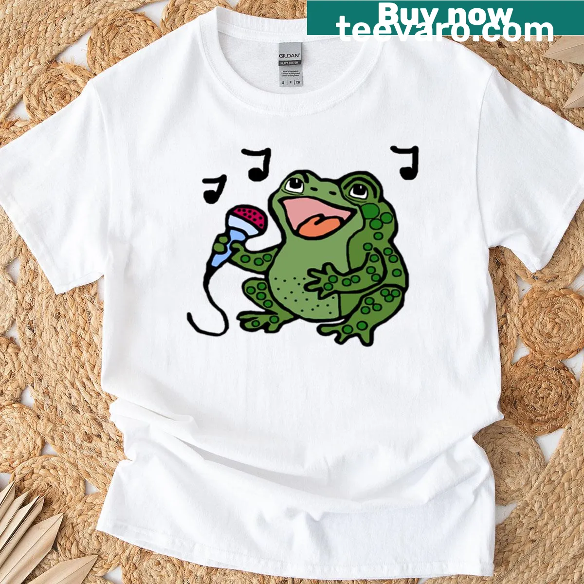 Playful frog singing graphic on a cartoon-style t-shirt — on a men's t-shirt