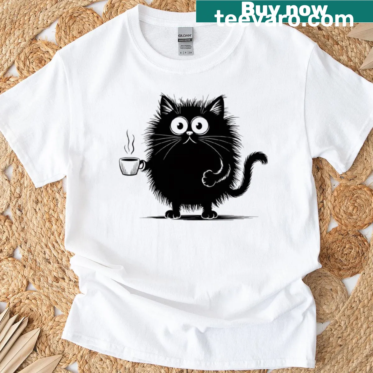 Cartoon black cat holding a steaming cup of coffee on a T-shirt. — on a men's t-shirt