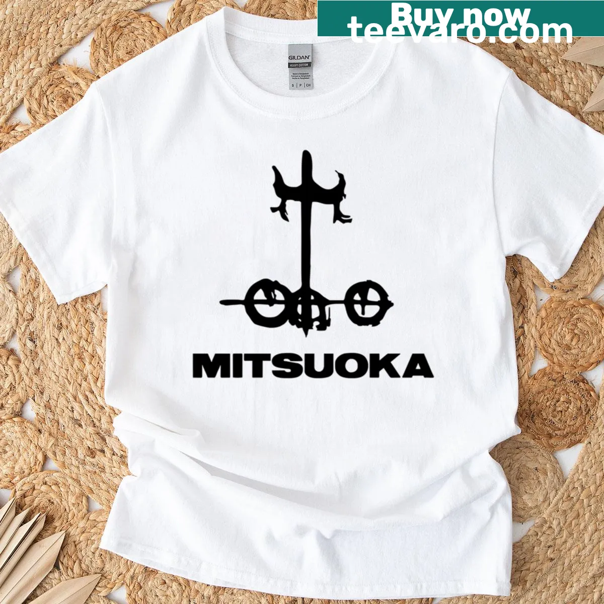 Minimalist T-shirt featuring the Mitsuoka logo — on a men's t-shirt