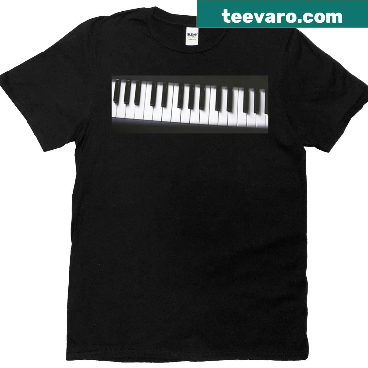 Elegant black and white T-shirt featuring piano keys close-up design — on a men's t-shirt