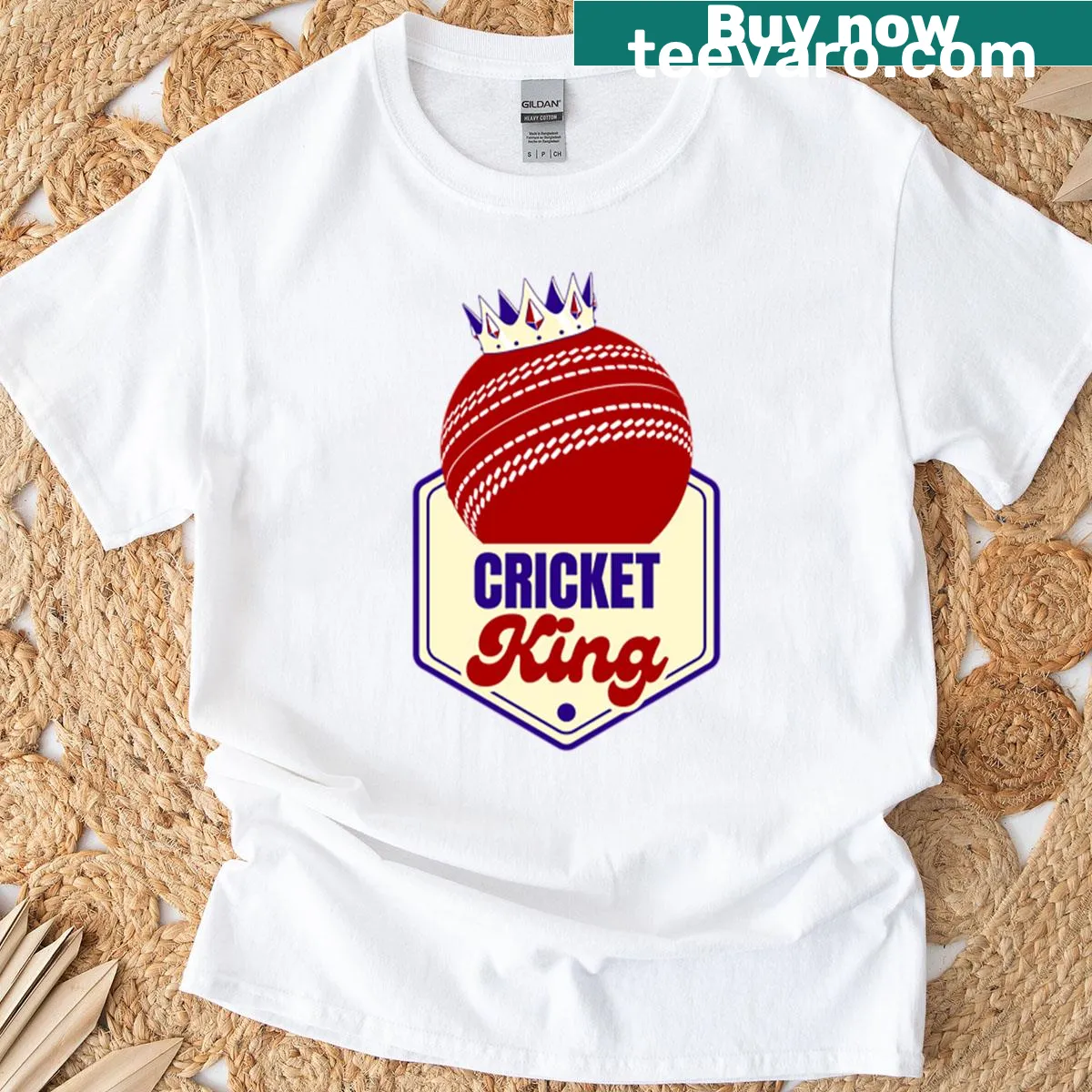 T-shirt featuring a red ball badge emblem for cricket fans — on a men's t-shirt