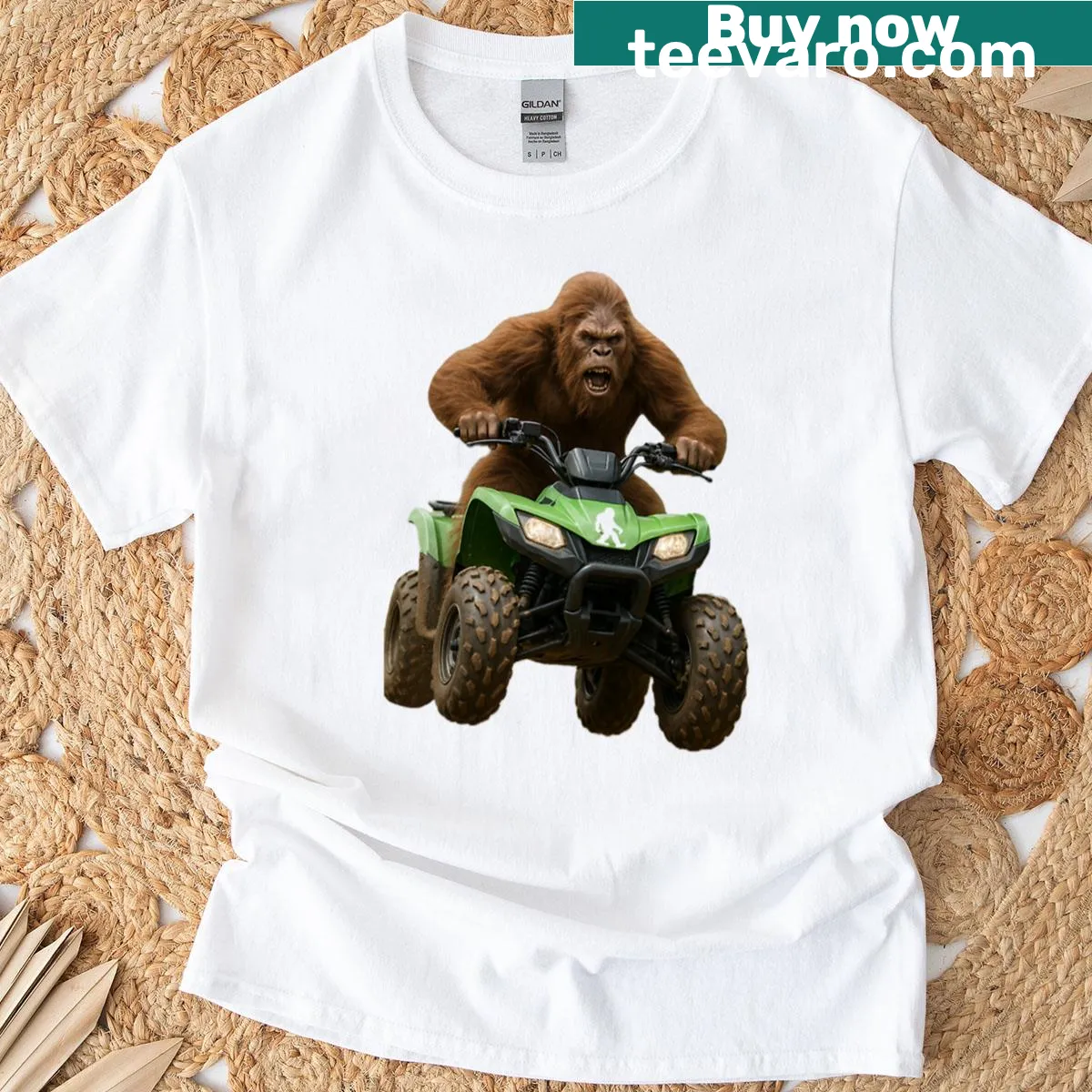 Cartoon Bigfoot driving a four-wheeler on a t-shirt — on a men's t-shirt