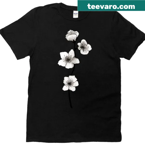 Black and white cherry blossom illustrations on a t-shirt.