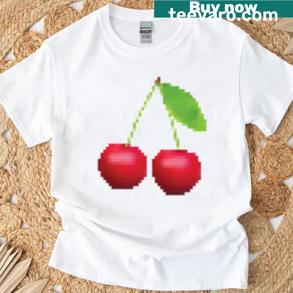 T-shirt featuring playful pixelated cherry graphics.