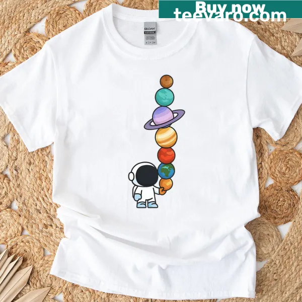 T-shirt featuring whimsical illustration of planets in space