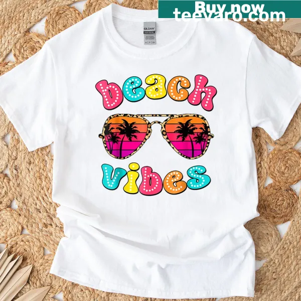 Cute retro t-shirt featuring a girl in sunglasses promoting beach vibes
