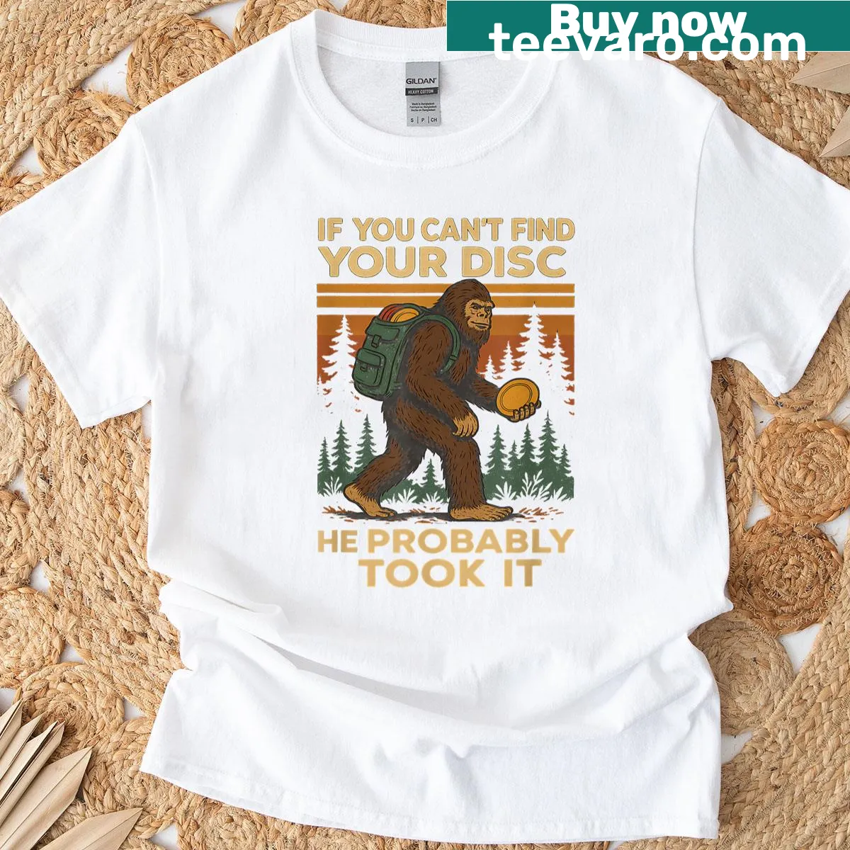 Cartoon Sasquatch playing disc golf on a T-shirt — on a men's t-shirt
