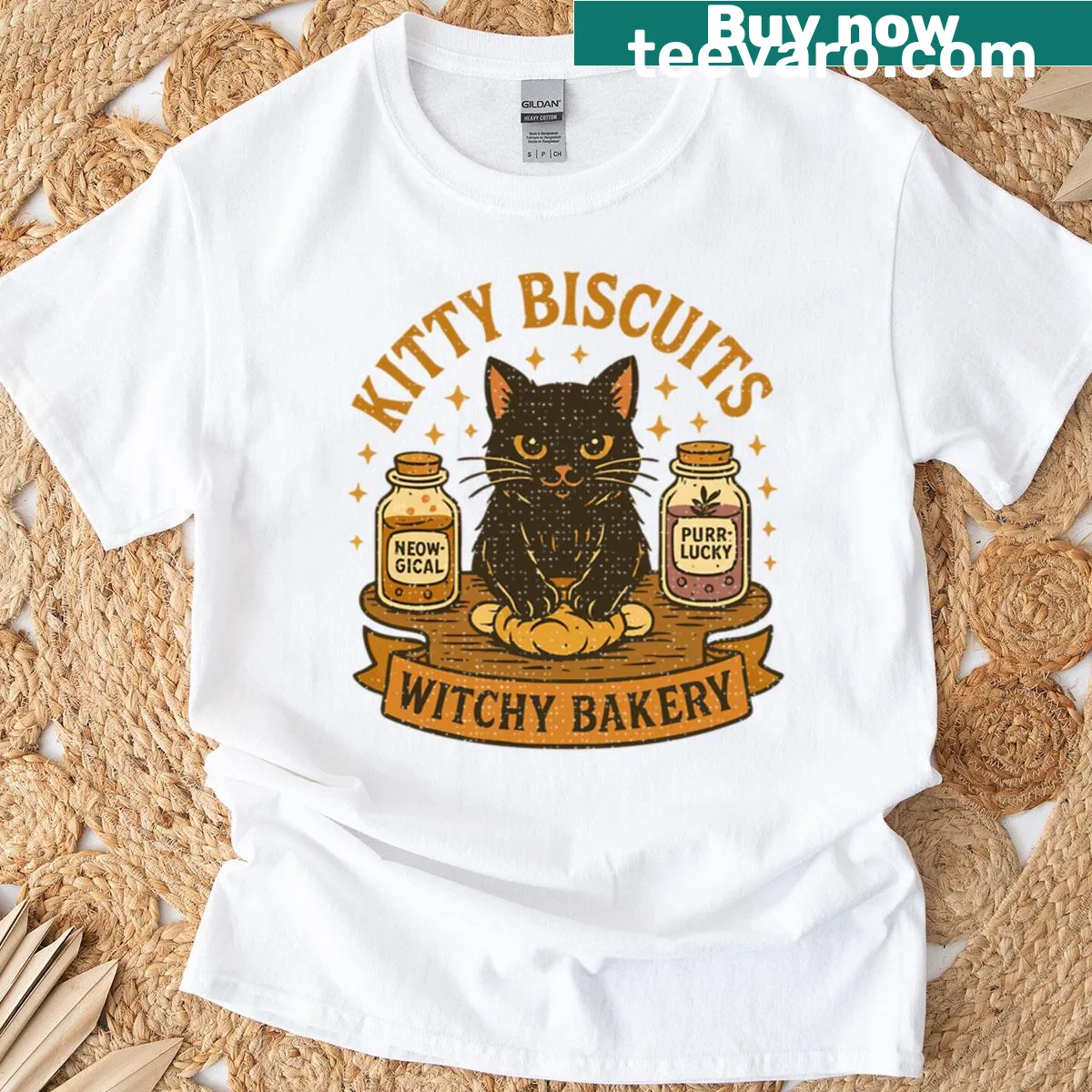 Whimsical cat bakery graphic T-shirt featuring a witchy kitty — on a men's t-shirt