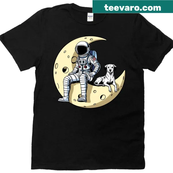T-shirt featuring astronaut dogs on the moon in a whimsical illustration.