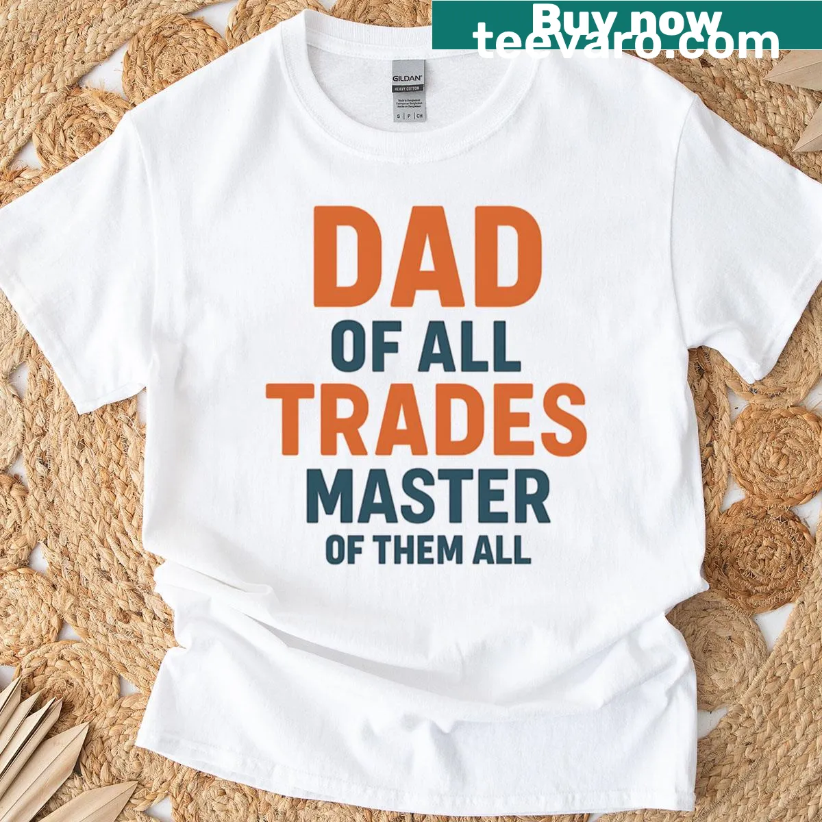 T-shirt featuring the phrase 'Dad Of All Trades Master Of Them All' in bold text — on a men's t-shirt