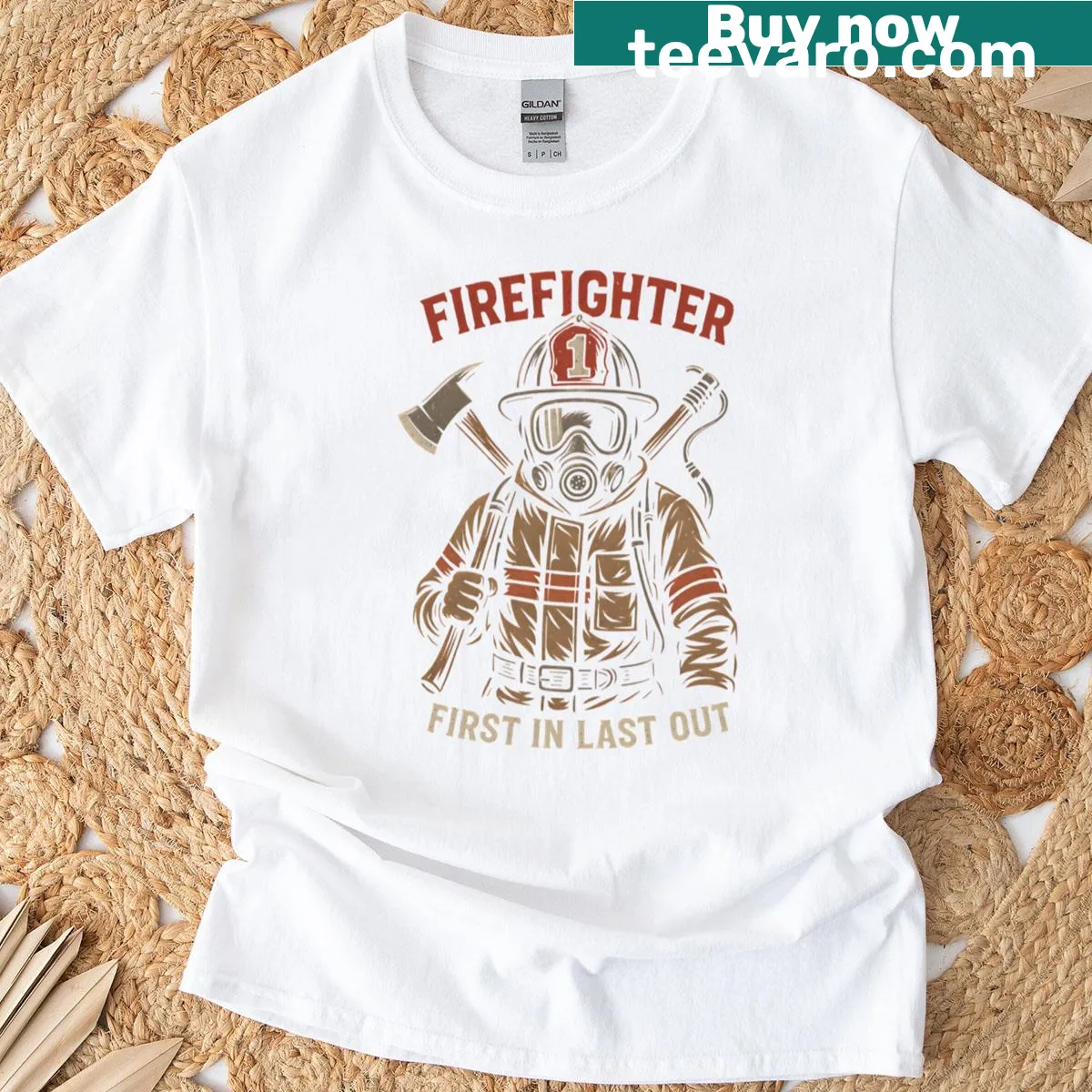 Firefighter t-shirt with a badge-style design reading 'First In Last Out' — on a men's t-shirt