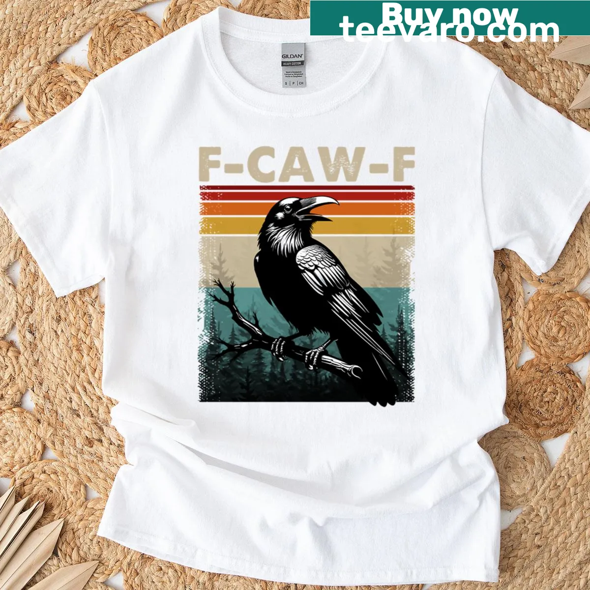 Vintage oversized T-shirt with a black crow on a sunset backdrop — on a men's t-shirt