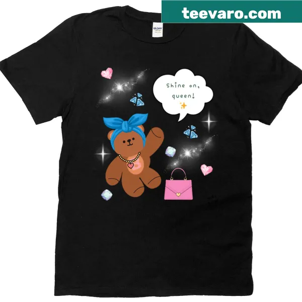 Dusty blue t-shirt with a bear graphic and 'Shine On Queen' message