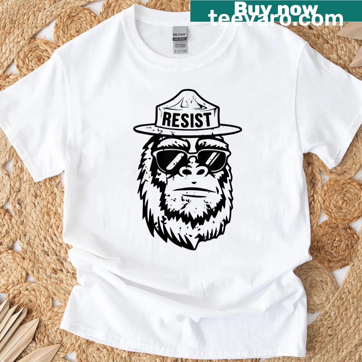 Illustration of Bigfoot and a bear with resist message on t-shirt — on a men's t-shirt